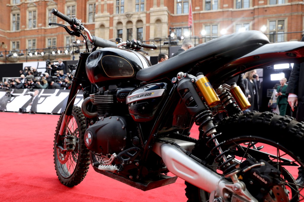 James Bonds Triumph Motorcycle at the World Premiere of "NO TIME TO DIE" The No Time To Die motorcycle completed an incredible two story jump in Matera Italy, using coca-cola | Tristan Fewings/Getty Images for EON Productions, Metro-Goldwyn-Mayer Studios, and Universal Pictures)