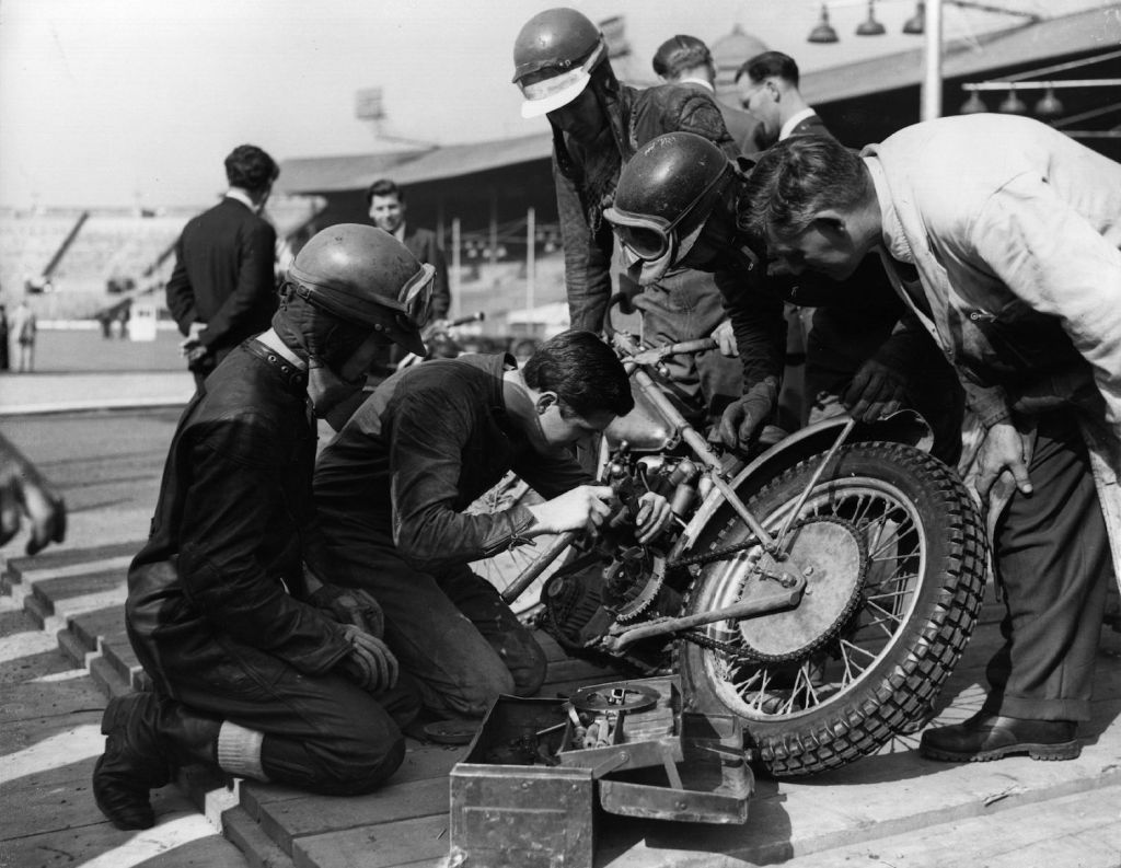 World speedway champion Barry Briggs repairs his motorcycle in the pits at Wembley, London, in 1958. Slow leaks have always been an annoying problem, but you can use soap to find a slow tire leak or valve stem leak. | Fox Photos/Getty Image
