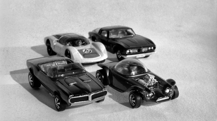 a black and white photo of a few toy cars. It's hard to believe the most expensive Hot Wheels Cars can be this small and silly.