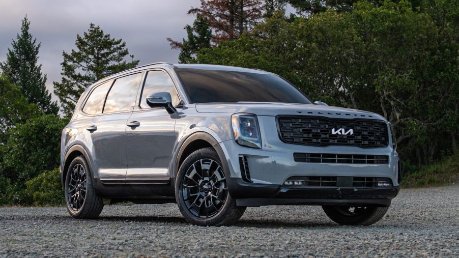 Everlasting Silver 2022 Kia Telluride parked in front of a forest