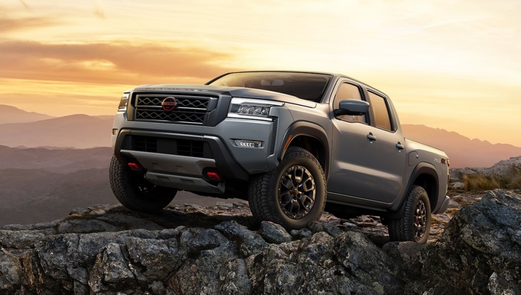 Gray 2022 Nissan Frontier parked on some rocks, it's one of the redesigned 2022 pickup trucks.