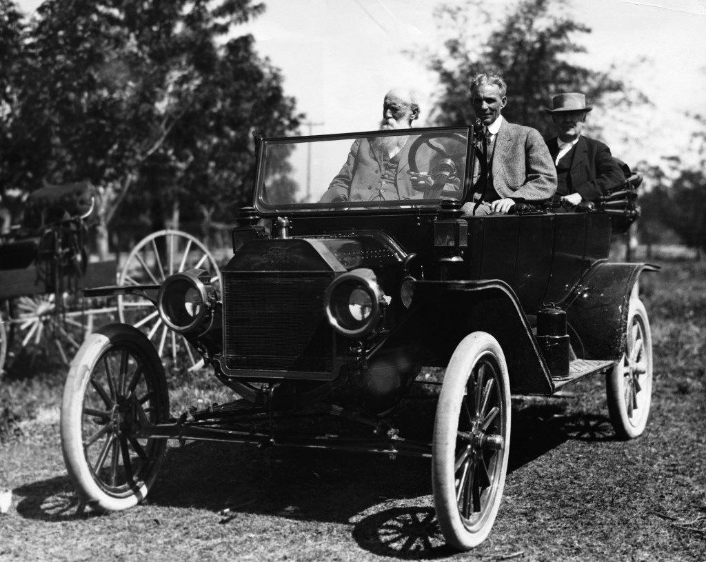 Henry Ford, John Burroughs, and Thomas Edison sitting in a Ford Model T