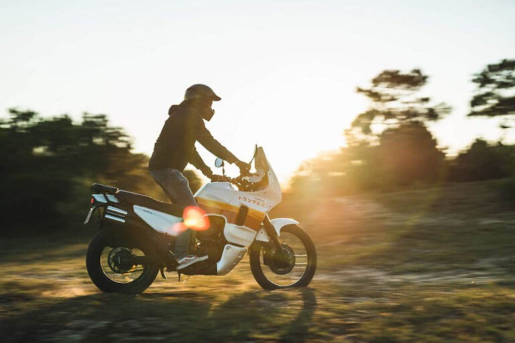 retro adventure bike riding at sunrise