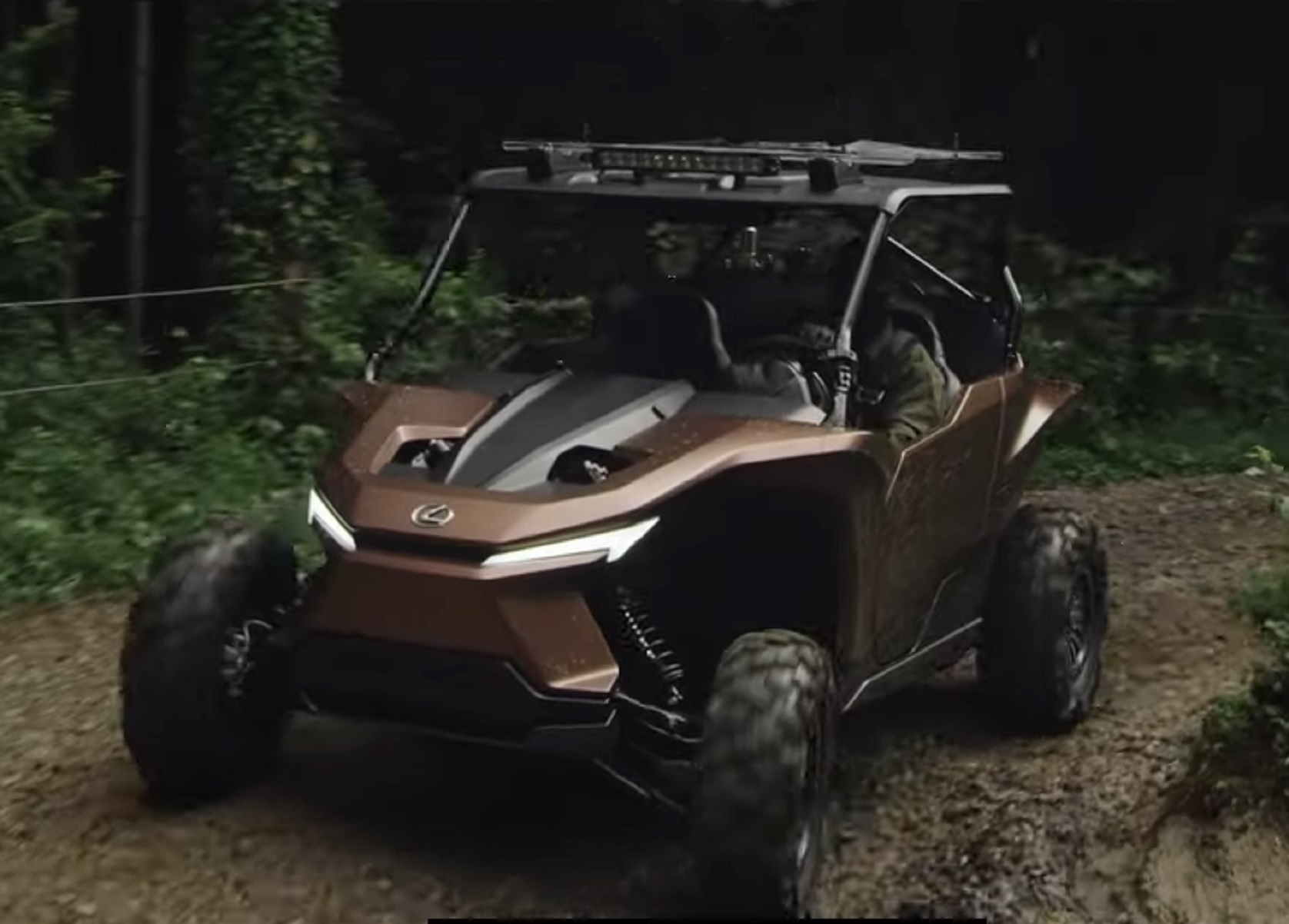 The copper-and-black Hydrogen-powered Lexus Recreational Off-Highway Vehicle Concept drives through a muddy forest