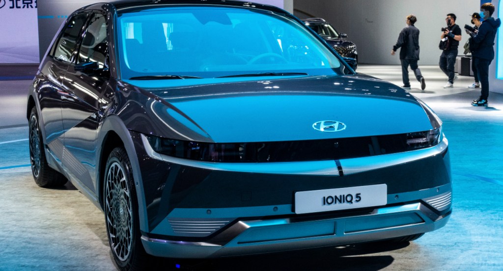 A black Hyundai Ioniq 5 electric SUV is on display.