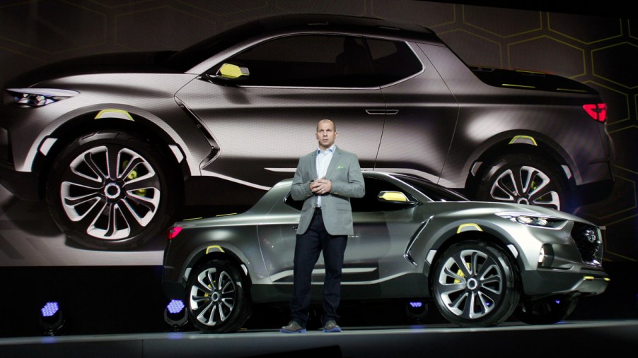 Hyundai Motors America Director of Corporate Planning, reveals a silver Hyundai Santa Cruz concept to the media at the 2015 North American International Auto Show (NAIAS) on January 12, 2015 in Detroit, Michigan.