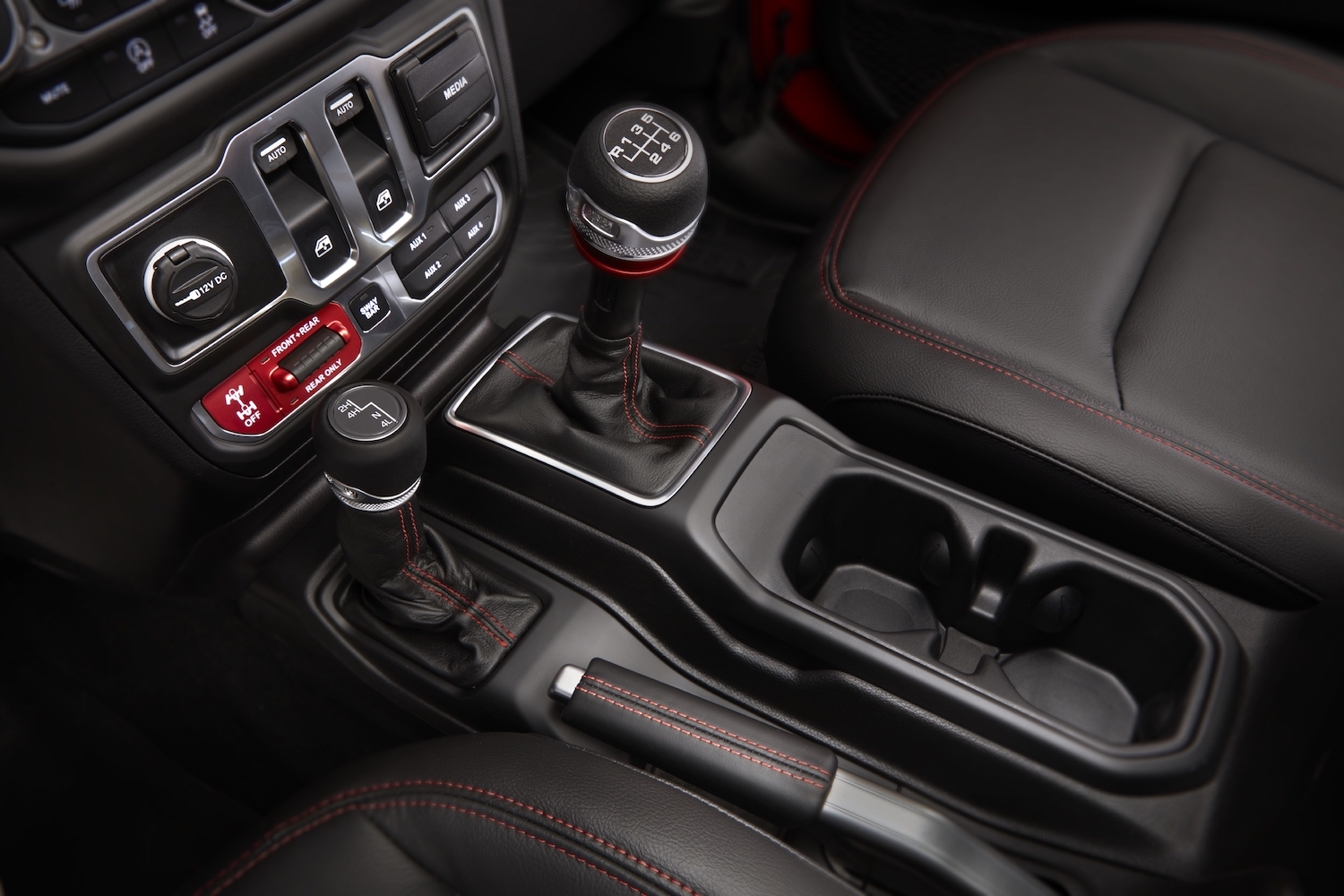 If your vehicle has a 2WD/4WD selector lever, like this 2021 Jeep Wrangler, four wheel drive is best reserved for low speed, low traction situations. It is bad to run 4WD all the time. | Stellantis