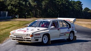 Jean-Claude Andruet's white-with-blue-and-red-stripes 1986 Citroen BX 4TC Evolution race car