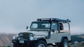 Ball and Buck's vintage Jeep CJ8 Scrambler on top of a mountain in the morning light