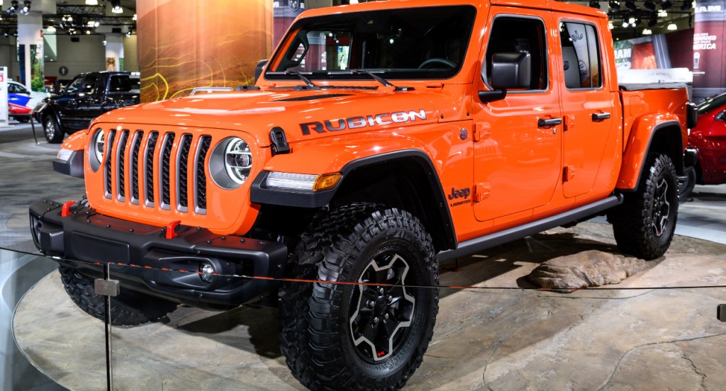 An orange Jeep Gladiator is on display.