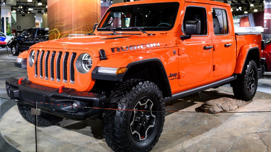 An orange Jeep Gladiator is on display.