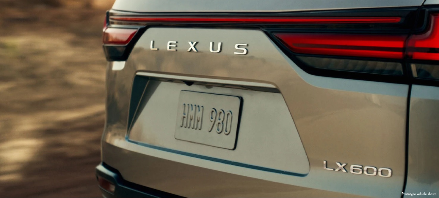 The rear of a gold prototype 2022 Lexus LX 600.