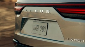The rear of a gold prototype 2022 Lexus LX 600.