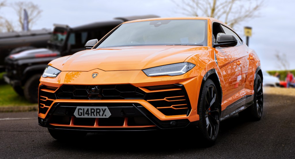 An orange Lamborghini Urus. 