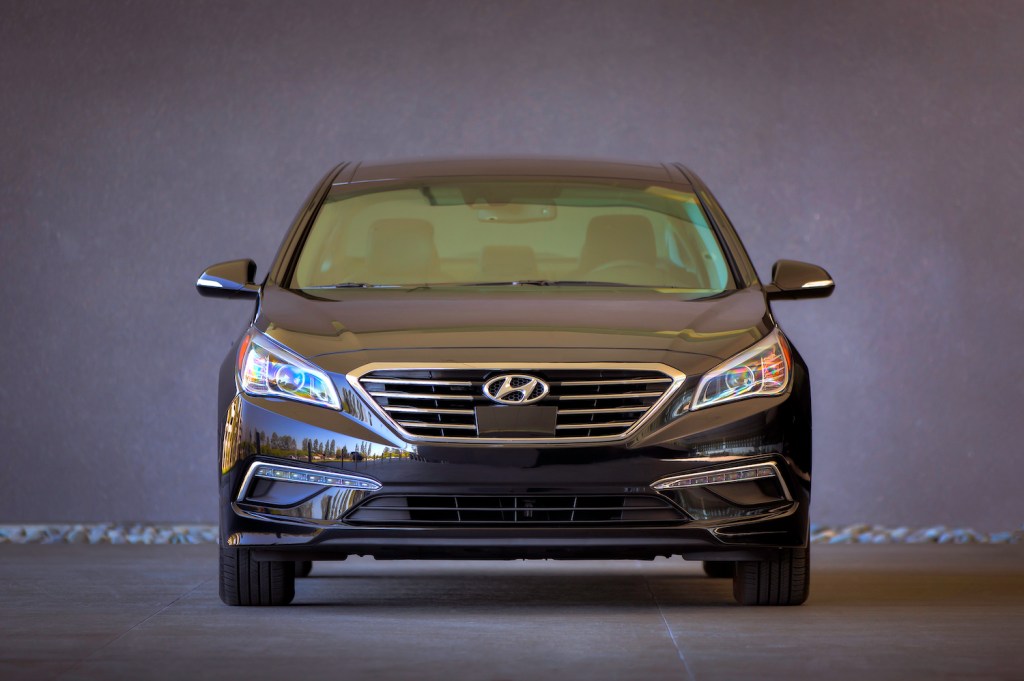 This is a promotional photo of the front of a black 2015 Hyundai Sonata. 466,000 Sonata sedans are at risk of a turn signal malfunction and affected by Hyundai recall. | Hyundai