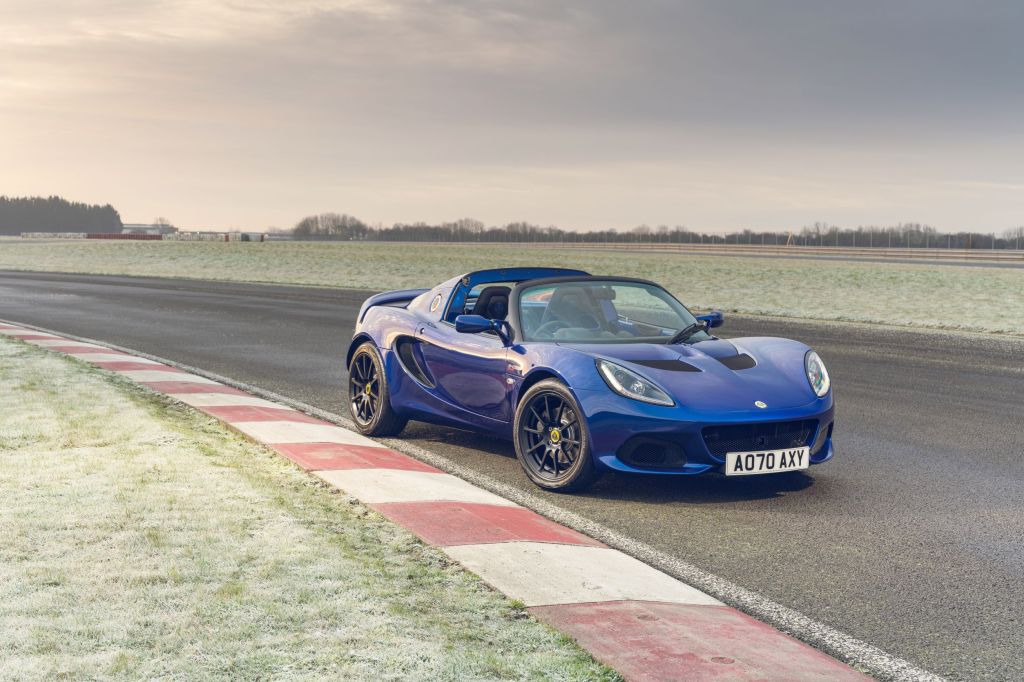 A blue Lotus Elise Sport 240 Final Edition on a frost-coated racetrack