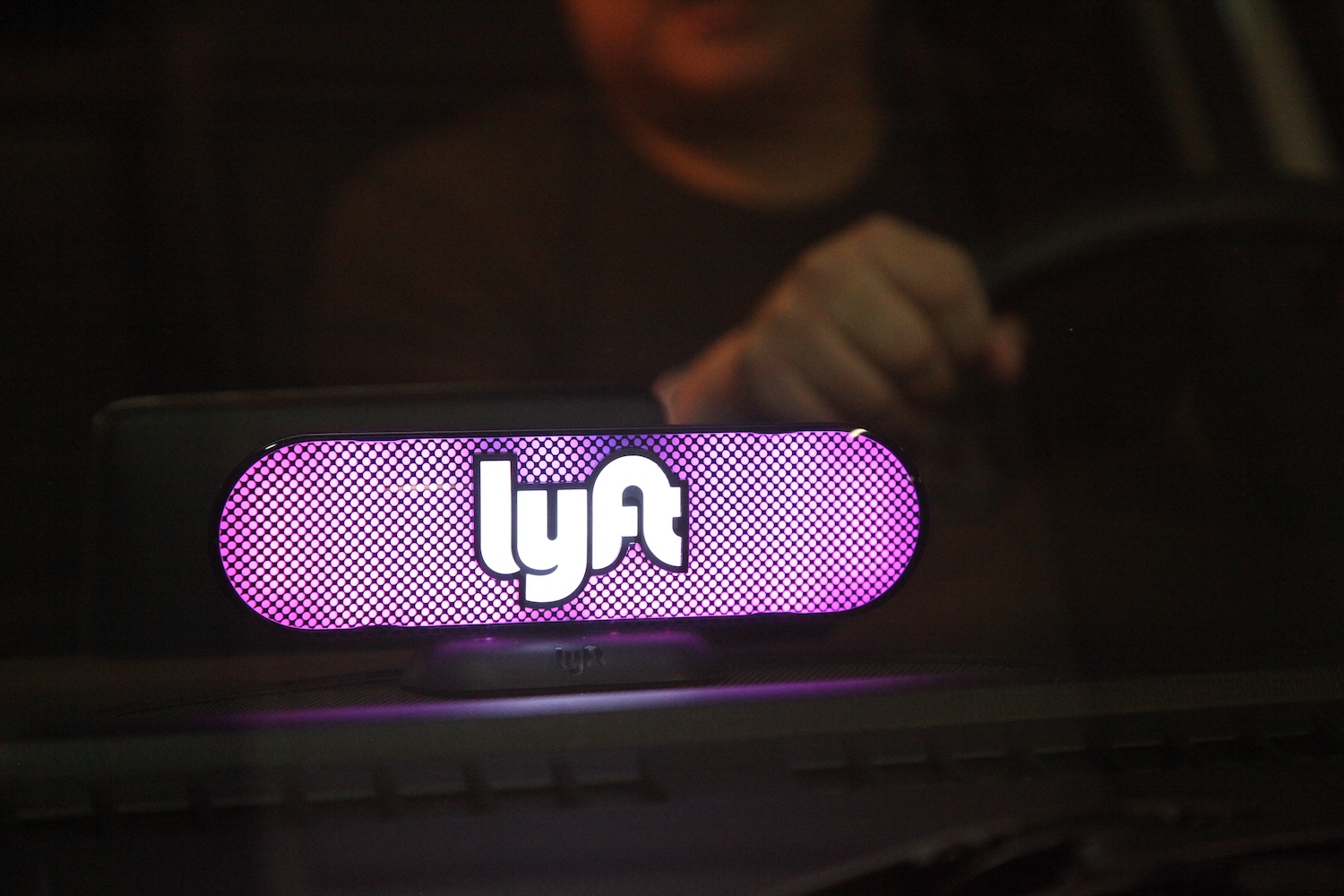 This is a photo of a Lyft rideshare car. The Lyft and Uber safety teams maintain lists of drivers and passengers banned for rape and other crimes. | Kelly Sullivan/Getty Images for Lyft