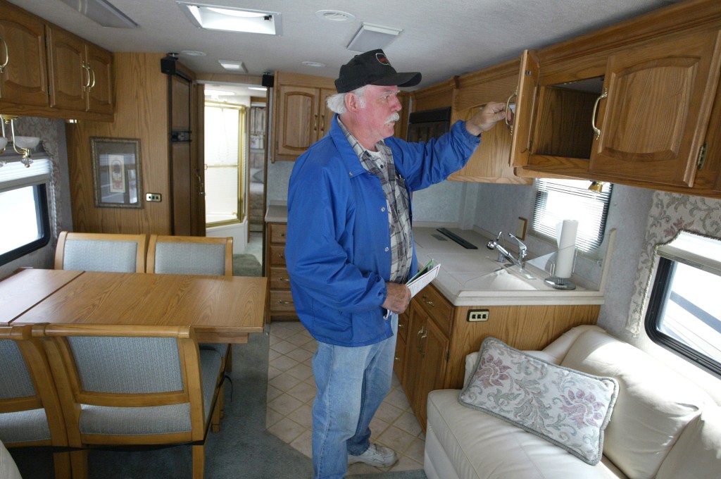 Man Inspects The Clean Interior of His RV
