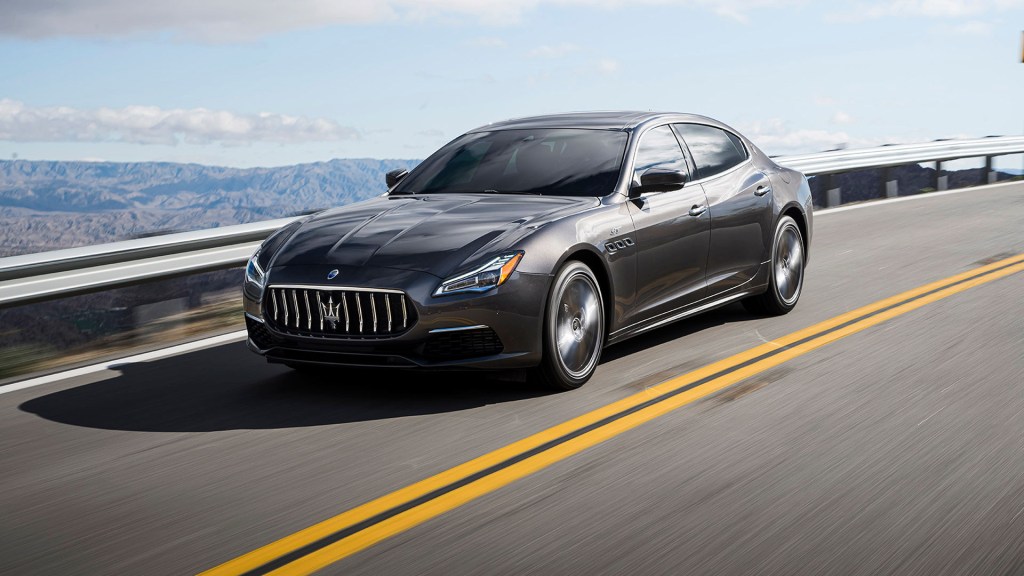 Maserati Quattroporte, the most expensive car to insure, driving on a mountain road