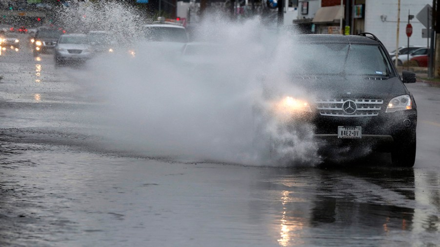 Mercedes Benz driving in the the rain. AAA recently revealed that driver assistance technology can be impaired by rain.