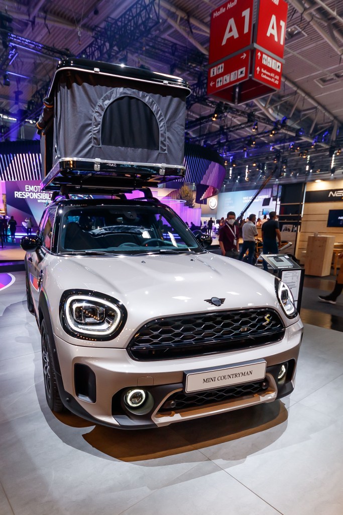 The 2021 Mini Countryman is the ultimate fuel-efficient SUV. This one has a rooftop tent. 