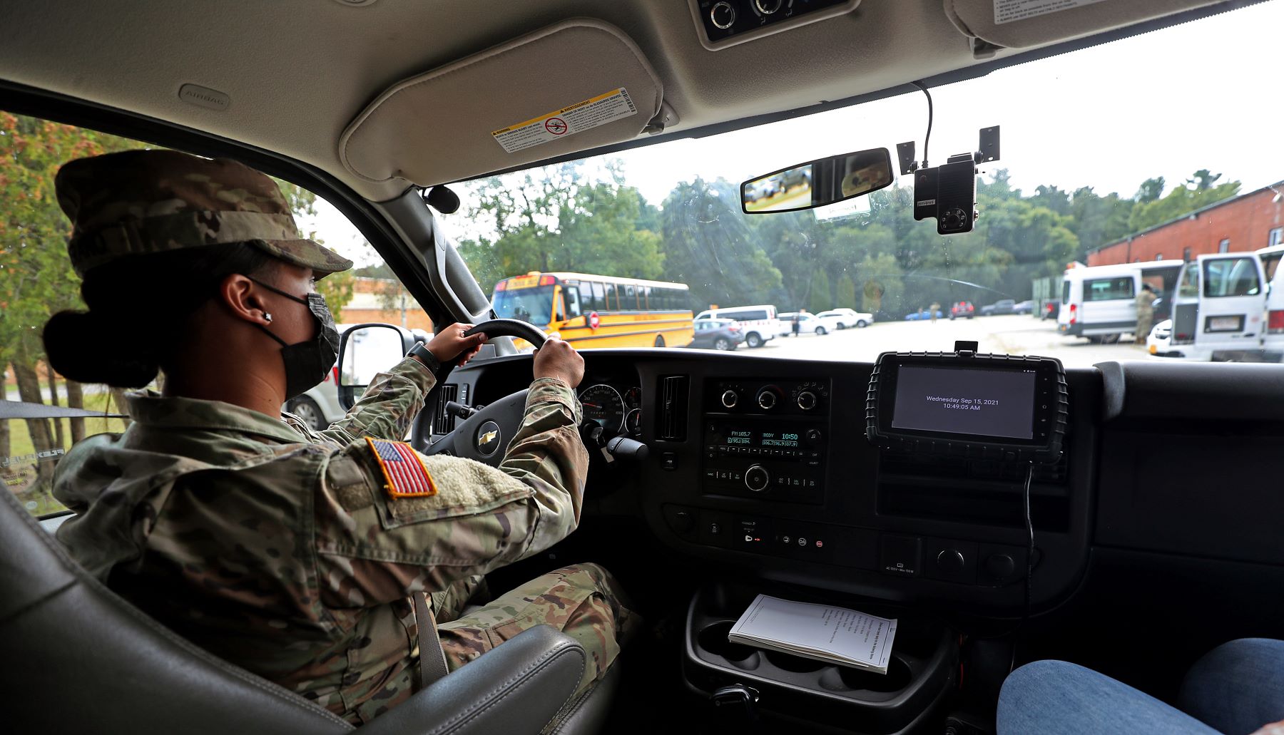 A National Guard member driving a school bus in Massachusetts