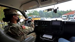 A National Guard member driving a school bus in Massachusetts