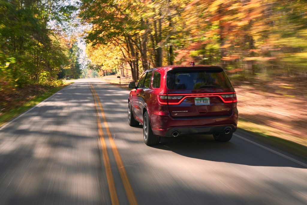 This is a promotional photo of the 2021 Dodge Durango SRT Hellcat in octane red. Dodged may have Killed The Durango Too Soon, the most recent SUV won Multiple Best Midsize SUV 2021 List Awards | Stellantis