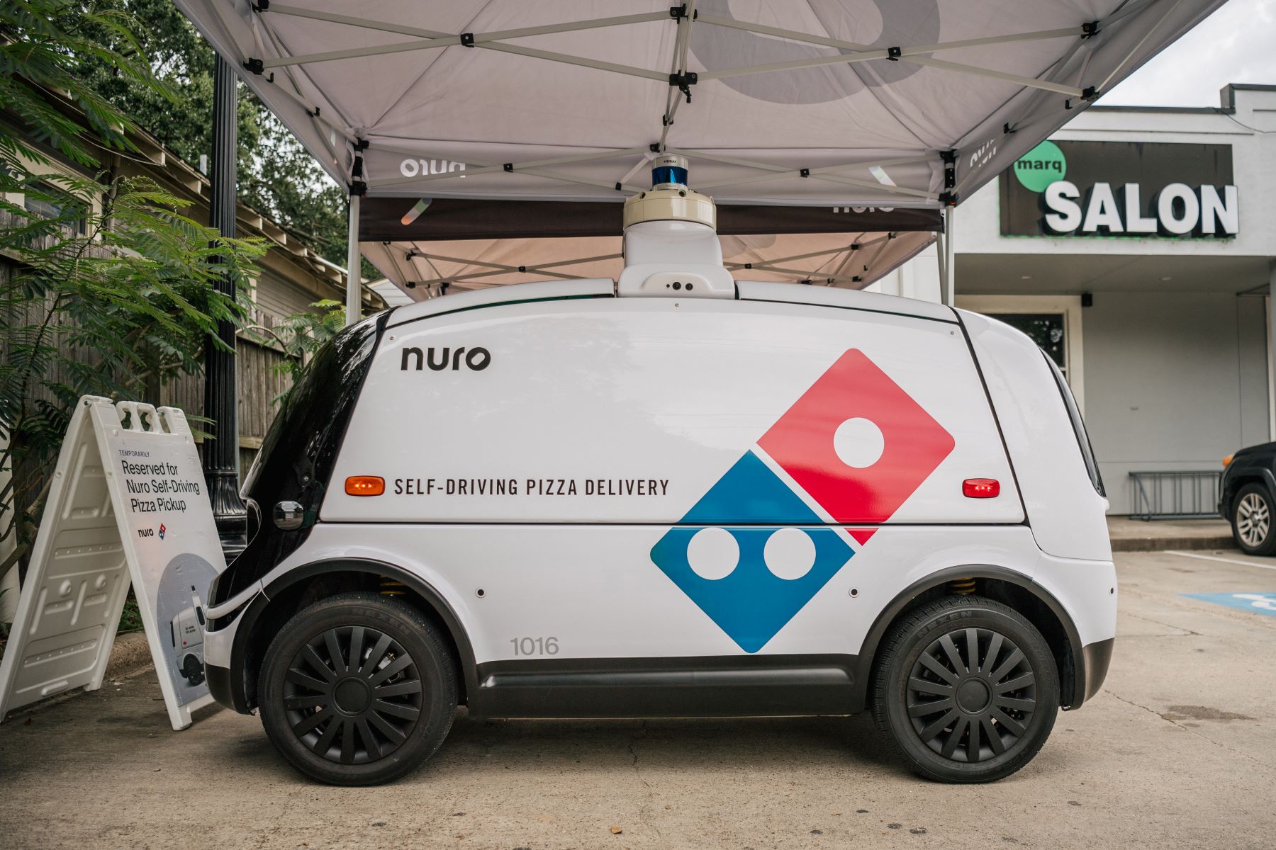 A Nuro R2 self-driving autonomous Dominos pizza delivery vehicle in Houston, Texas