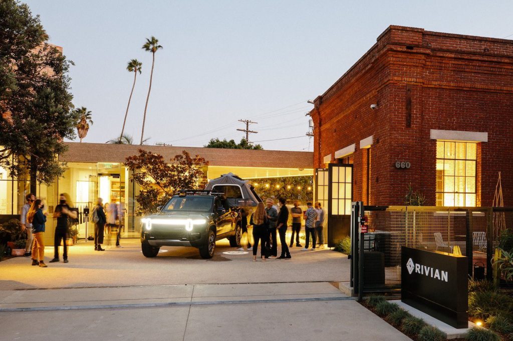 People having a party around a Rivian R1T at the Venice Rivian Hub