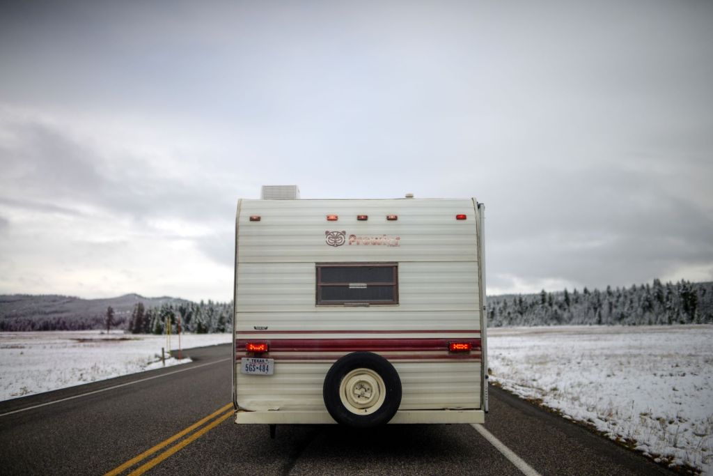 RV, in need of insulation, driving through the snow.
