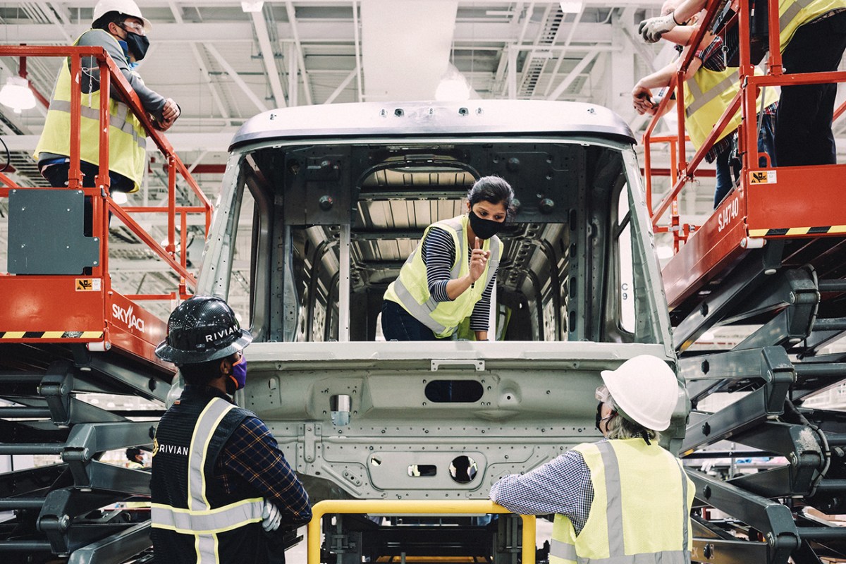 An Amazon electric delivery van being assembled at a Rivian assembly plant.