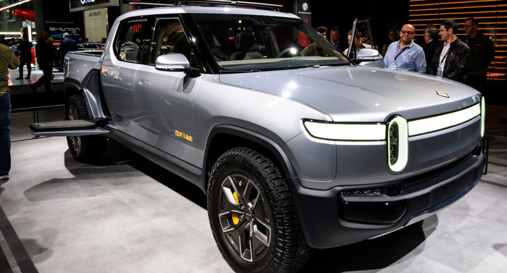 A gray Rivian R1T electric truck is on display. 