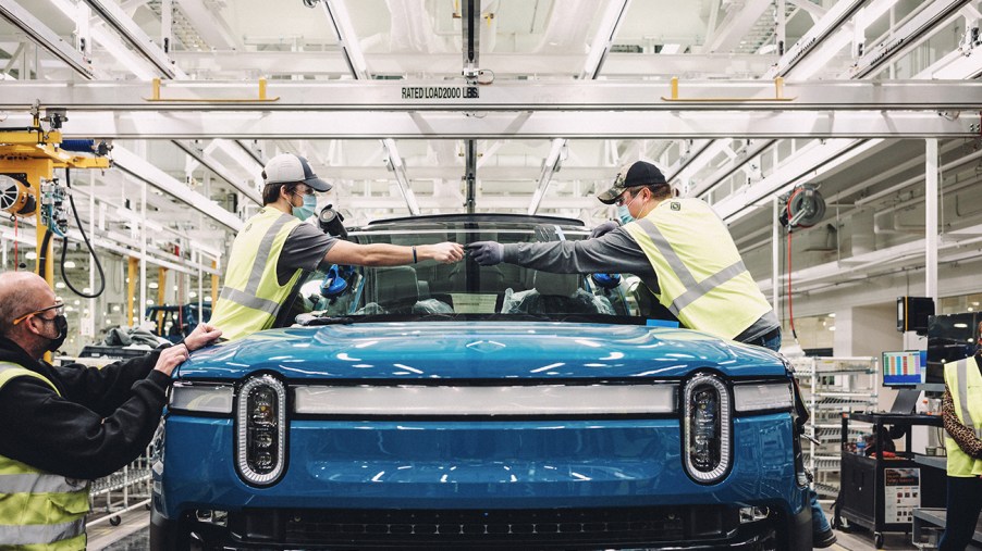 Rivian R1T EV truck on a production line. Rivian is planning to make their own EV batteries in house.