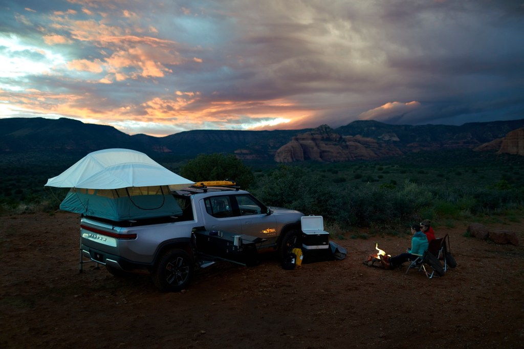 This is a promotional photo of the Rivian R1T camping. Rivian and Motor Trend have Complete dThe First Electric Transcontinental Overland Expedition | Rivian