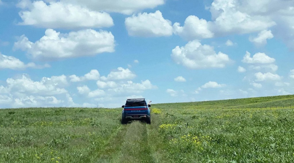 This is a promotional photo of a blue pre-production 2022 Rivian R1T. Rivian Electric Truck Designed for Luxury, Not Overlanding, Despite Rivian Off Road Capabilities. | Rivian
