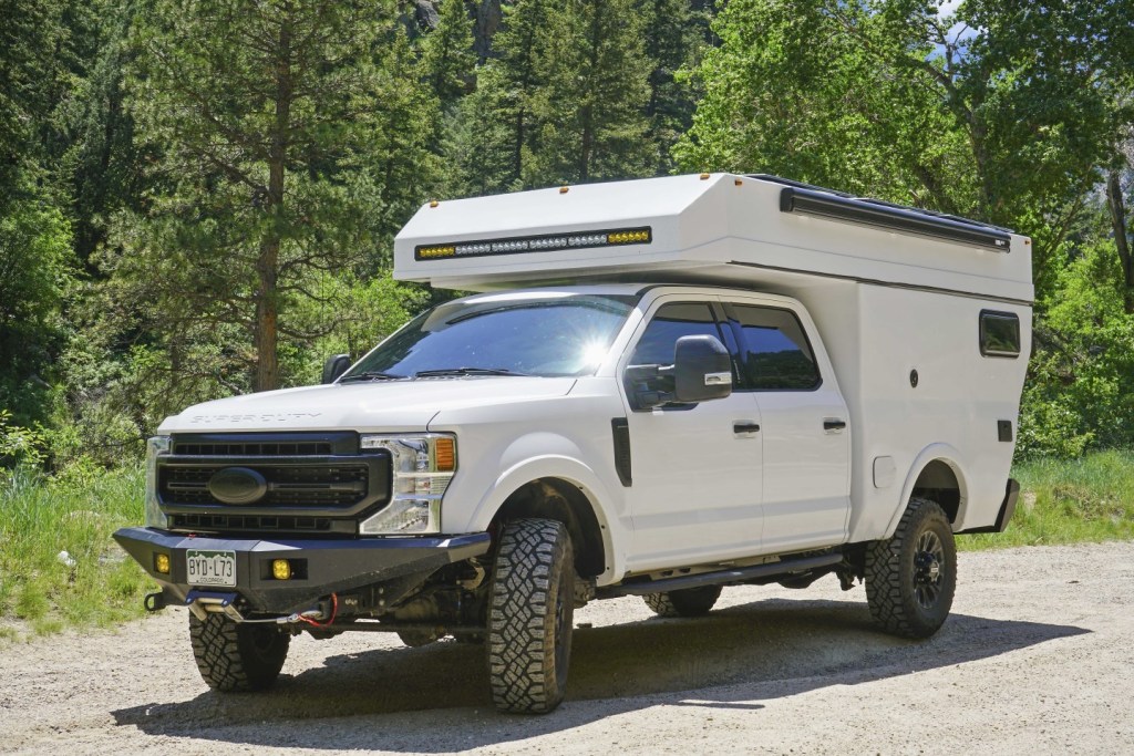 The Rossmönster Ford F-150 Baja camper truck seen parked in a gravel pit