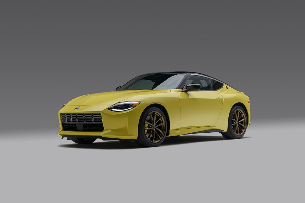 2023 Nissan Z in yellow with a black roof and bronze wheels. This version of the new Z car will be on display at SEMA 2021