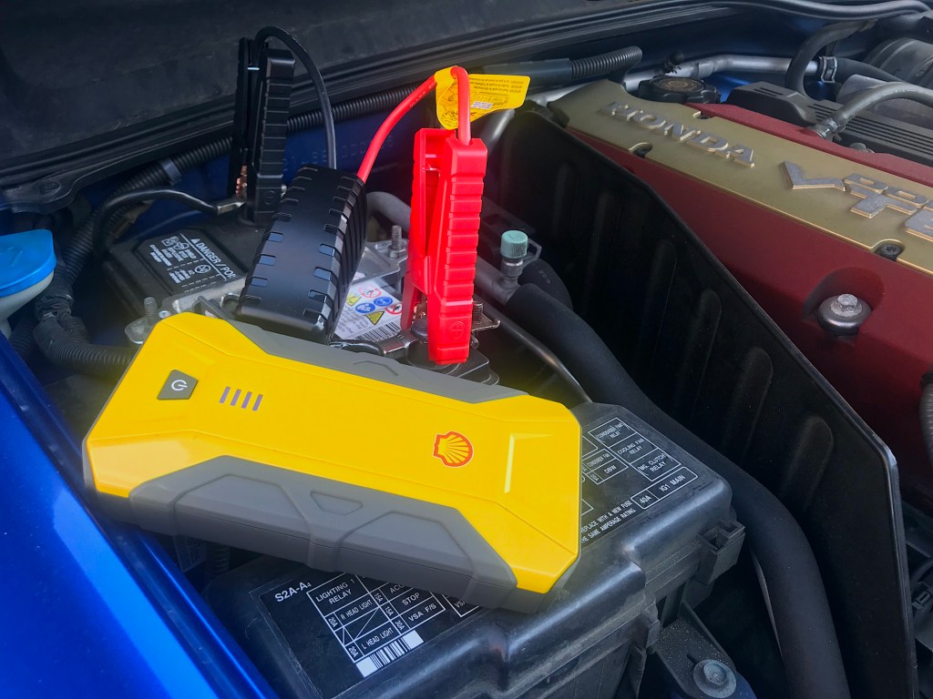 The Shell SH912 jump starter connected to the battery on my S2000