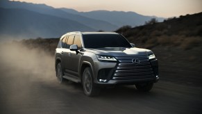 Silver 2022 Lexus LX 600 driving on a dirt road