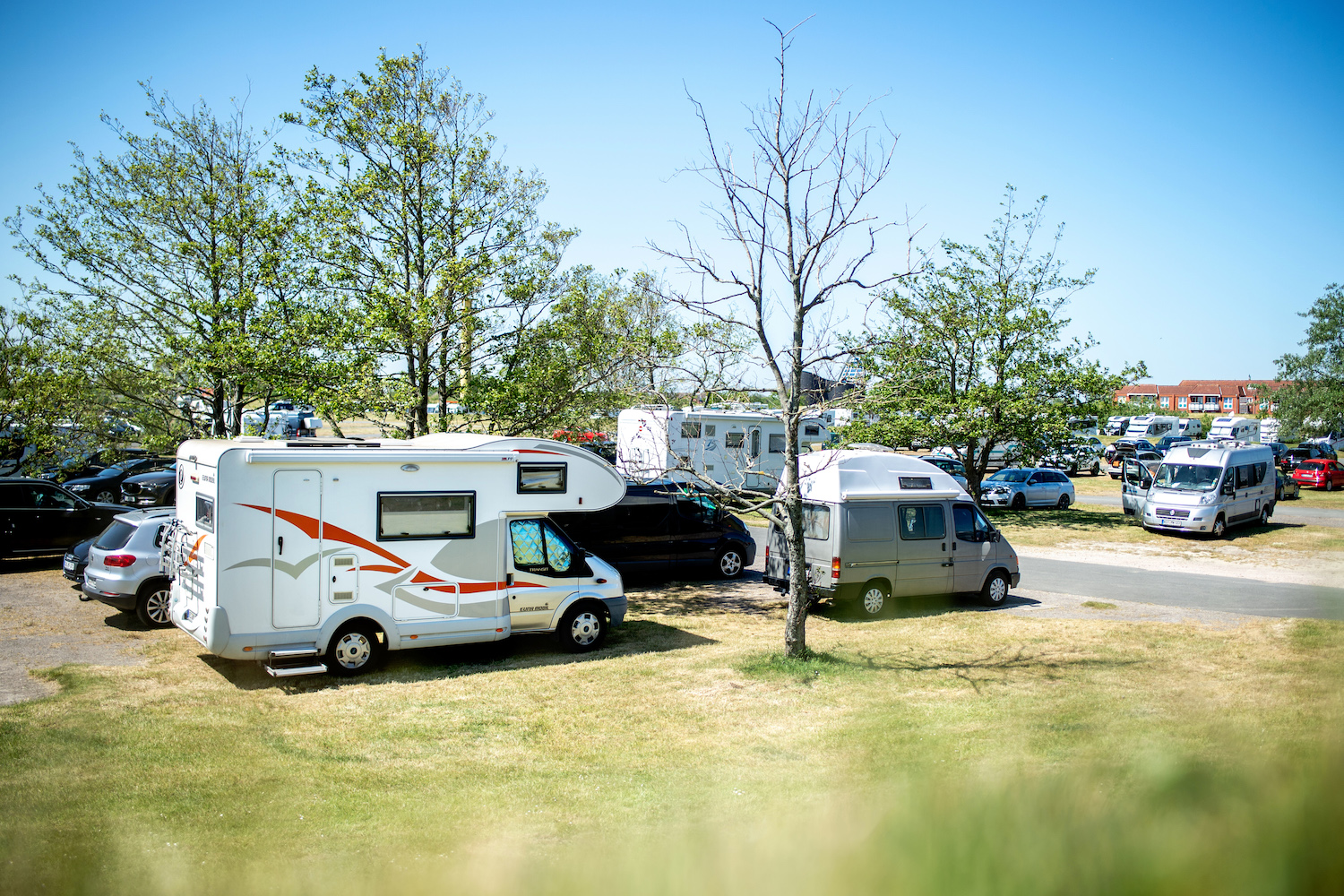 This is a lot of RVs and cars. Many cities have a safe park program listing lots where you can sleep in a car. | Hauke-Christian Dittrich/picture alliance via Getty Images