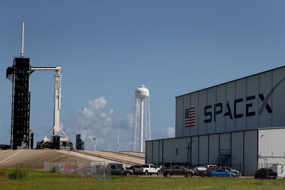 SpaceX building with launchpad in the background.