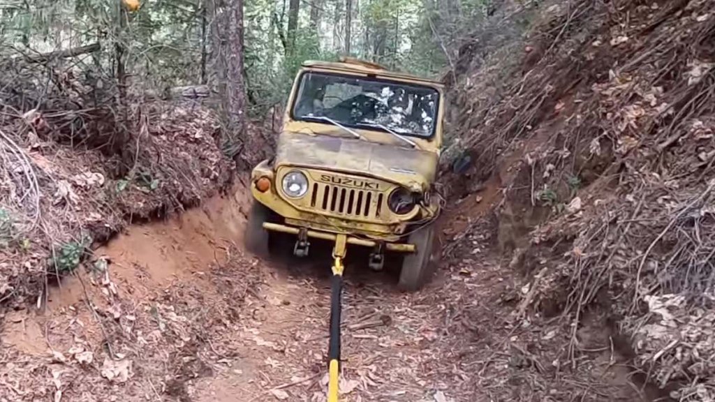 Suzuki Jimny being pulled from off-road nightmare after 47 years. 