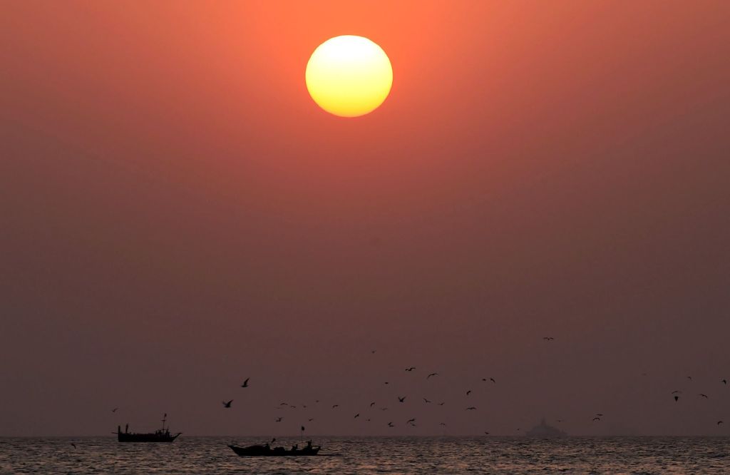 Sunset over boats in the Arabian Sea near the Makran Coastal Highway, Pakistan