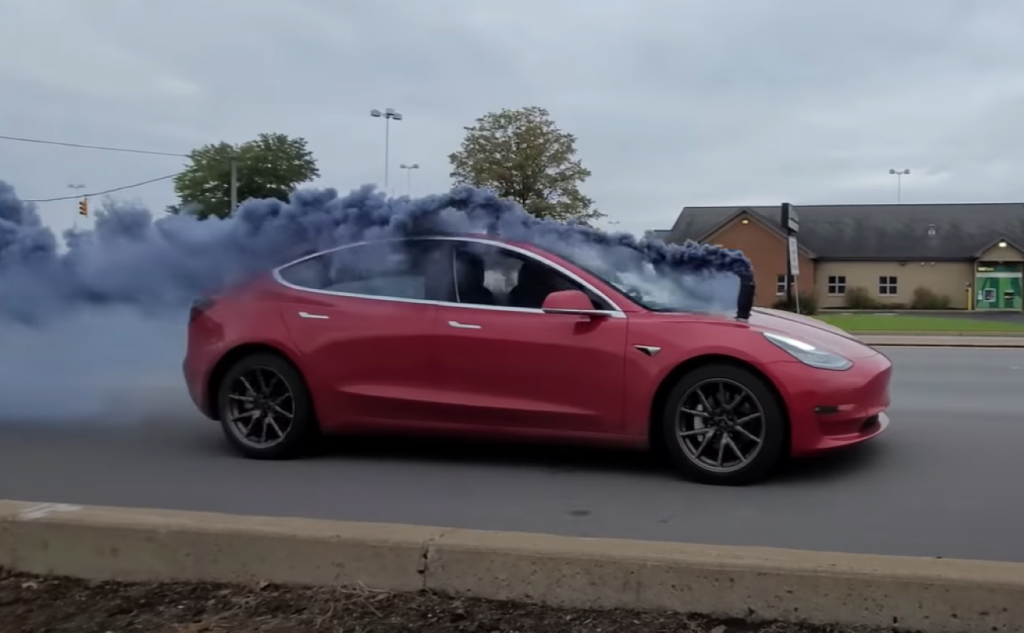 Tesla Model 3 rolls coal on city street
