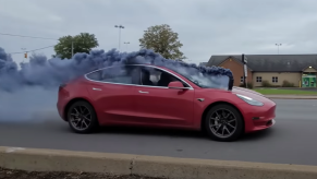 Tesla Model 3 rolls coal on city street