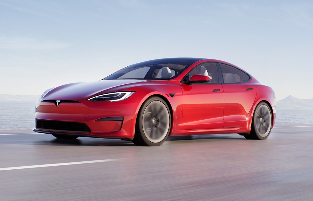 A red Tesla Model S Plaid similar to the one featured in the drag race video in this article