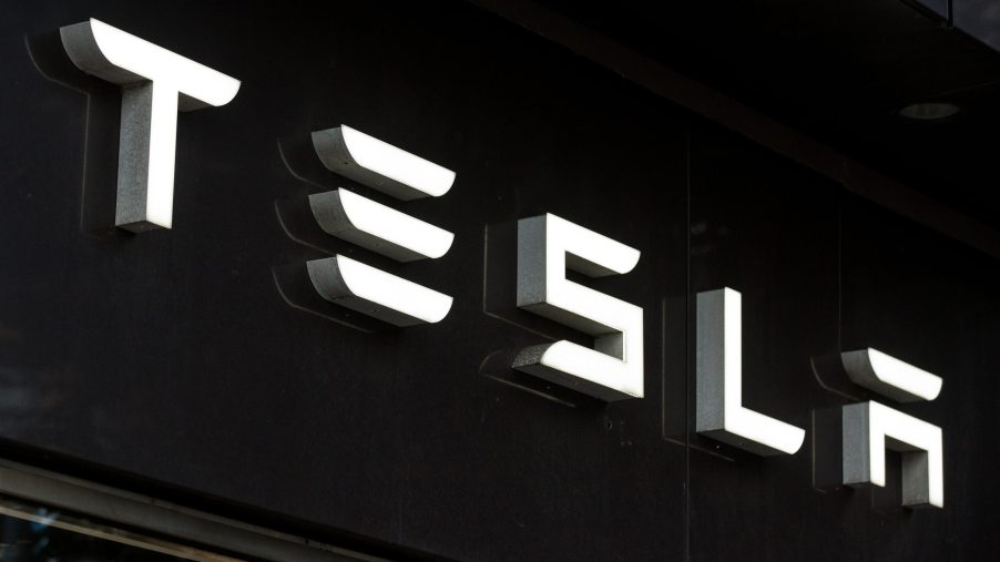 Tesla logo written out in white on a black background.
