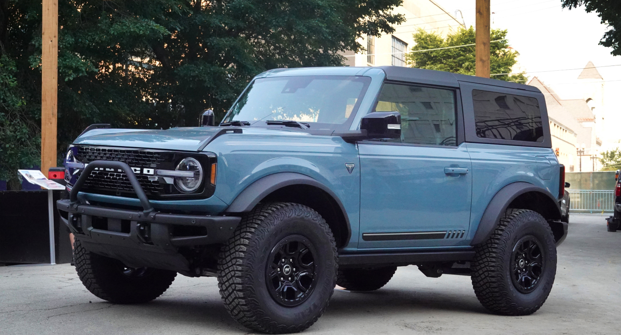 A blue 2021 Ford Bronco is parked.