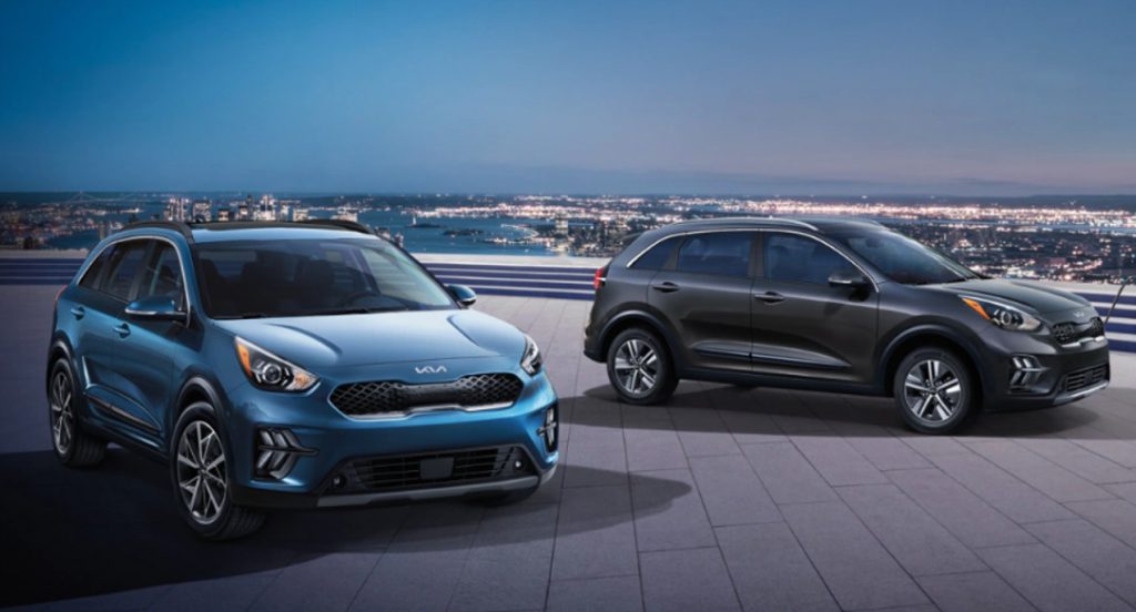 Two Kia Soul subcompact SUVs are parked.
